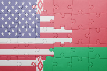 puzzle with the national flag of united states of america and belarus