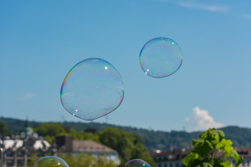 Colorful soap bubbles on a city street