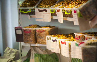 farm animal foods in containers on a market stall