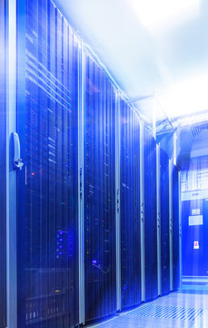 room with rows of server hardware in the data center