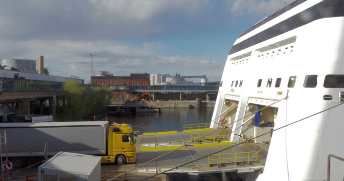 Truck getting into cargo section of a ship