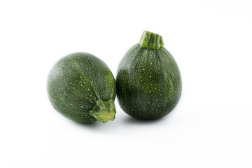 Organic round green courgettes zucchini, isolated background