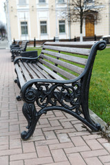 Fototapeta na wymiar benches on a city street in autumn