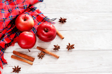 
Christmas winter background, red apples with cinnamon, spices , Christmas cookies and cocoa on a...