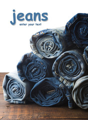background of a stack rolled jeans