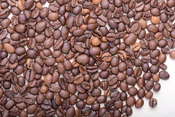 Brown coffee beans,  close-up of coffee beans for background and texture