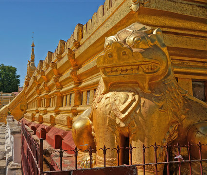 The golden lion guardian sculpture at the basement of Swezigon pagoda