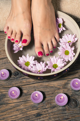 Obraz na płótnie Canvas Close up of a female feet in spa salon