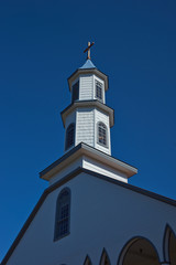 Historic wooden Church of Our Lady of Sorrows in the small village of Dalcahue in Chiloe, Chile.