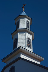 Historic wooden Church of Our Lady of Sorrows in the small village of Dalcahue in Chiloe, Chile.