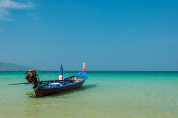Fototapeta premium Fishing boat at the beautiful beach ,Lacated at Phatong beach Phu Ket province ,Thailand