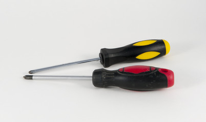 Two Phillips screwdrivers against a white background