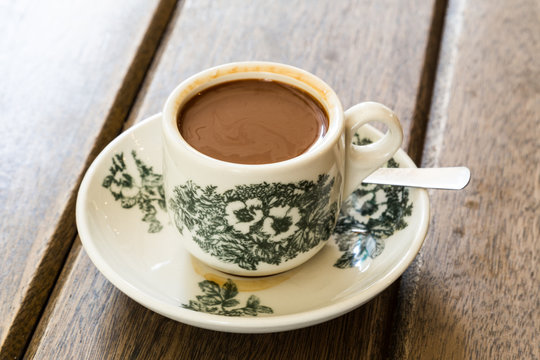 Fototapeta Traditional oriental Chinese coffee in vintage mug and saucer, on wooden table top
