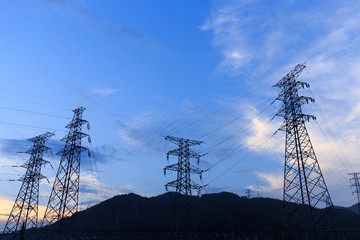 pylon on hill in blue sky