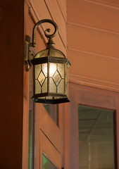 Fototapeta na wymiar Beautiful luxury light lamp decor glowing on wood