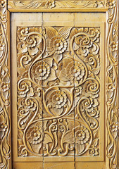 Pattern of flower carved on wood background