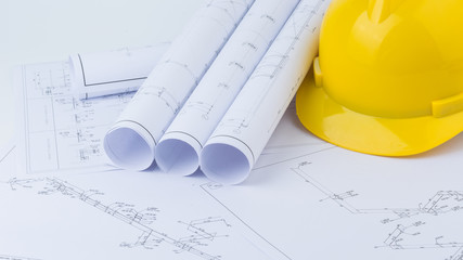 Yellow safety helmet and plan drawing