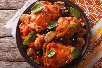 Homemade Cacciatori chicken on a plate close-up. horizontal top view
