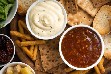 assortment breads and appetizers with sauces, top view