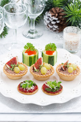 Set of festive Christmas mini appetizers, vertical