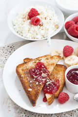 sweet breakfast - crispy toasts with fresh raspberries, banana 