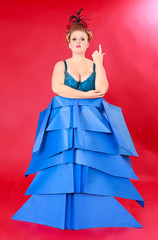 Fat Woman in Unique Blue Dress Against Red