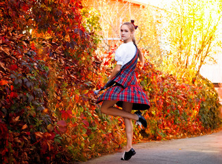 Girl dancing in the Irish dance costume