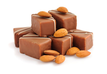 Chocolate praline with almonds on white background