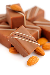 Chocolate praline with almonds on white background