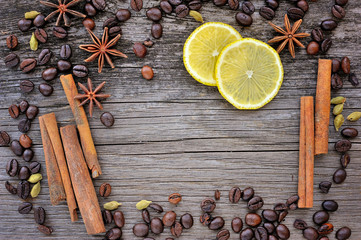 Close-up of cinnamon, anise and coffee beans on a rustic wooden