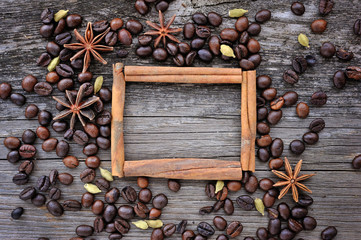 Anise star and cinnamon sticks in the frame made from roasted co