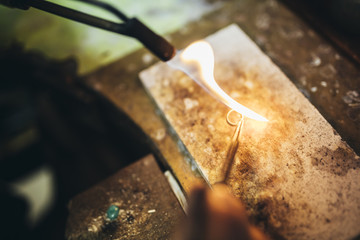 Goldsmith making a ring