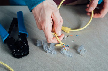 Man building networking data cable