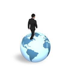 Businessman walking on globe with world map