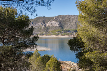 Fototapeta na wymiar Views of Buendia Reservoir, in the upper waters of the river Tagus, Cuenca, Castilla La Mancha, Spain. The surface area of the reservoir measures 8,194 hectares