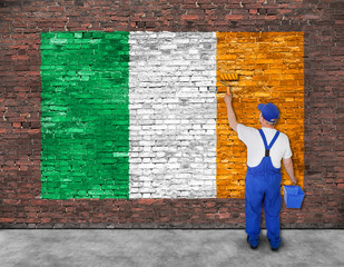 House painter paints flag of Ireland