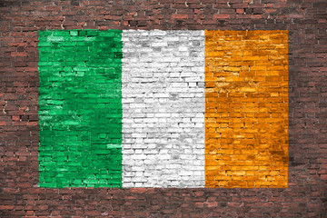 Flag of Ireland painted over brick wall