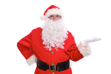 Kind Santa Claus pointing in white blank sign, isolated on white background