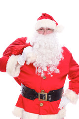 Kind Santa Claus carrying big bag, isolated on white background