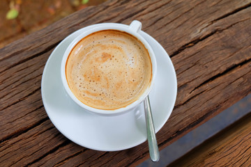 Coffee cup on the wooden table