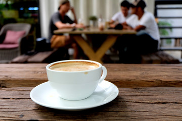 Coffee cup on the wooden table