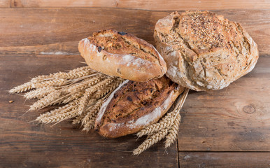 Fresh cereal breads with ears of wheat