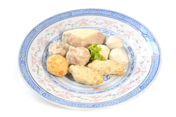 Chinese style minced pork stuffed tofu and mixed fish ball on blue plate, white background