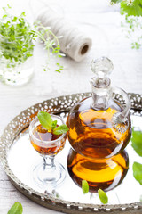Herbal, mint homemade liquor. Russian traditional strong spirits