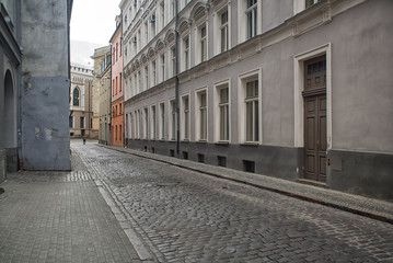 Narrow medieval street in old town of Riga city, Latvia.