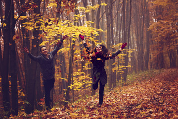 Portrait of couple enjoying golden autumn fall season