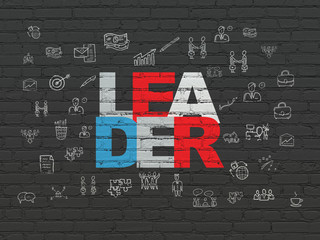 Business concept: Leader on wall background