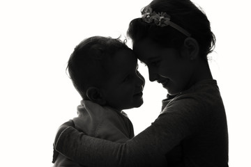 Baby boy and girl silhouette over white background.