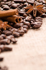 Coffee beans, cinnamon and stars of anise on the table