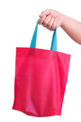 closeup hand holding reusable bag isolate on white clipping path